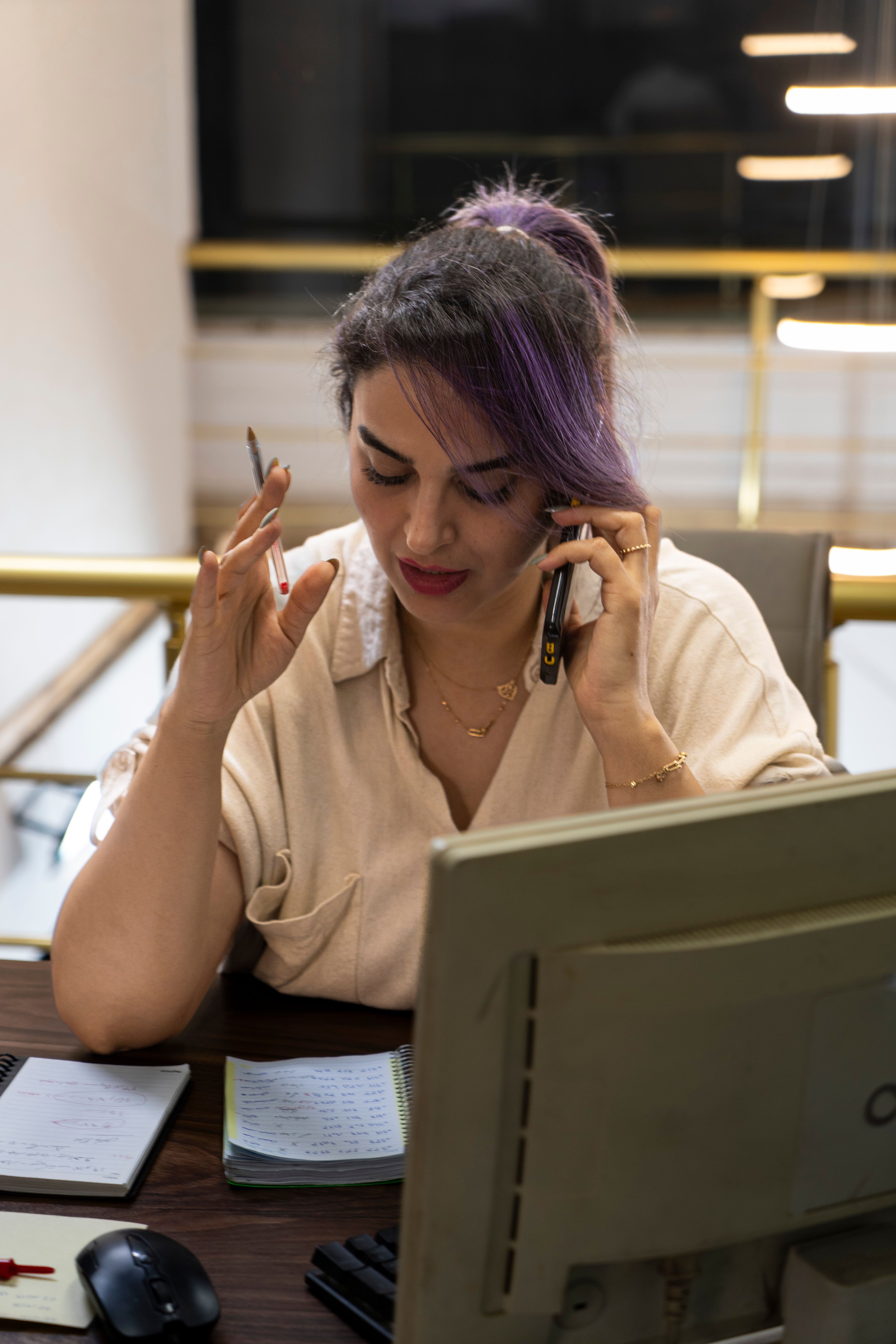 Overwhelmed business owner surrounded by financial paperwork