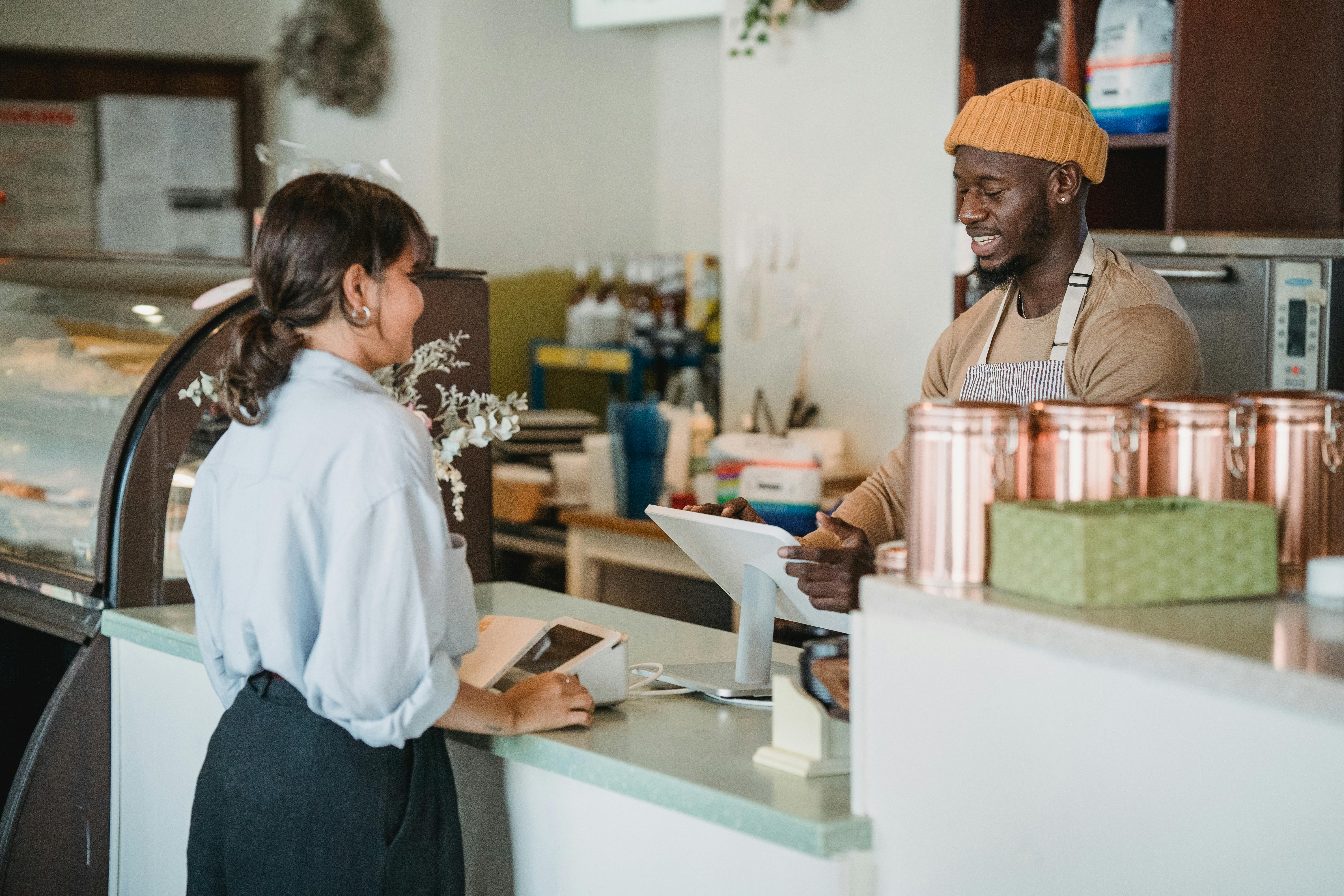 Small business owner reviewing financial records at their desk